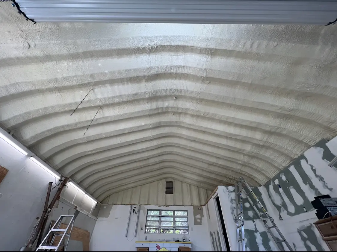 Spray polyurethane foam applied to the underside of a metal roof deck in West Pensacola